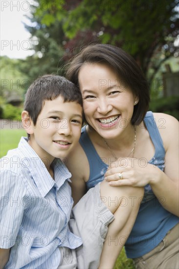 Asian Mother And Son Hugging Photo Tetra Images Inti St Clair