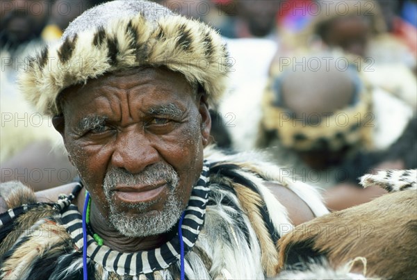 Heritage Day in South Africa Coincides with the Zulu celebration of Shaka Day in honour of the founding king of the Zulu nation. On this day the Zulu King, currently King Goodwill Zwelithini, the Zulu Royal Family, the chiefs and large crowds of Zulu subjects in traditional clothing gather to celebrate. There are speeches, but there is also much dancing and singing. 

It was during the speeches when all the press cameras were turned on the King and Zulu politicians of the likes of former vice president Jacob Zuma, that I managed to get close to a group of amakhosi (chieftains) to take individual portraits. It is a sign of disrespect to look an older man, and particularly an "inkosi" in the eye so I had to work carefully. I kept low and my subjects were fortunately gracious.