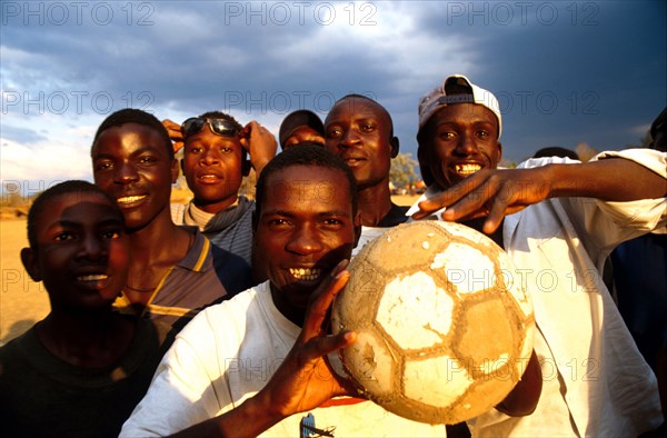 Farm workers   forget the insecurity of their position in a game of soccer