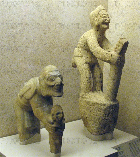 Limestone figure of an old man and boy Huaxtec