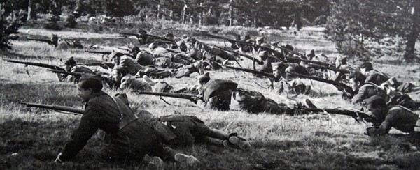 Nationalist soldiers advance in battle, during the Spanish Civil War