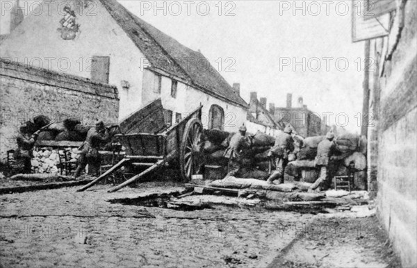 Photograph of combat barricades in the streets of St. Laurent