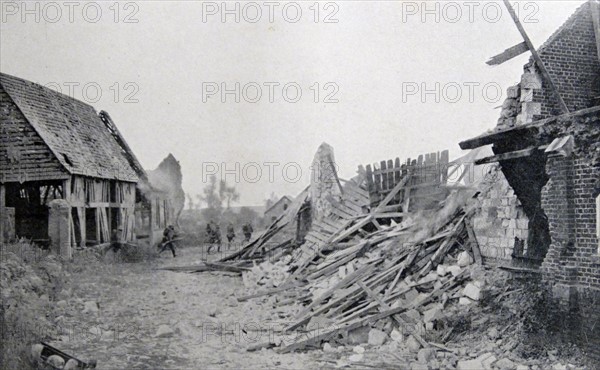 German soldiers advance across a ruined French village