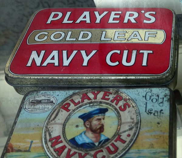 Tin of cigarettes and Tin of shredded tobacco