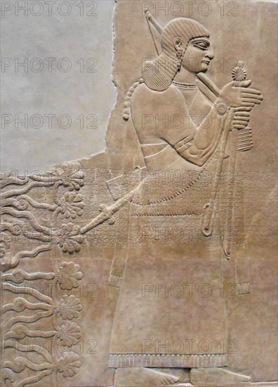 relief depicting a king and eunuch attendant