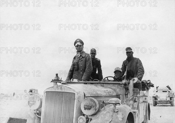 Rommel, Erwin 1891-1944
Officer, field marshall general , germany 
commander of the Afrikakorps Feb.1941-March1943
General (of the Panzertruppe) Rommel in his command post vehicle during the battle in Tobruk - Sidi Omar region. 
November 1941