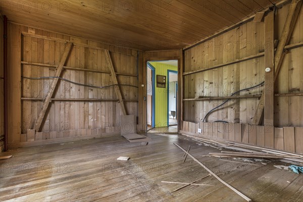 A room paneled with wood in a house that will be demolished