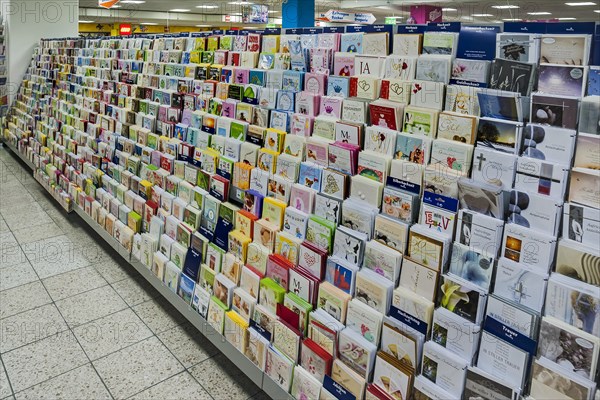 Shelf with postcards in a supermarket