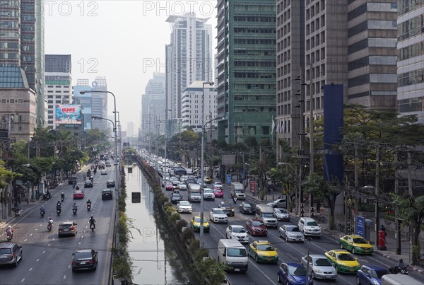 Busy road with Khlong in the middle