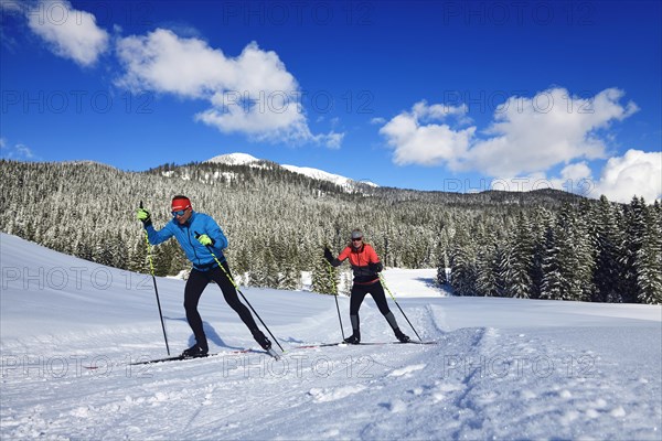 Olympic silver medalist Tobi Angerer with his wife Romy on the cross-country ski trail of Winklmoos-Alm