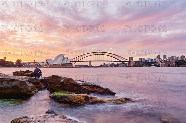 Sydney Opera with Harbour Bridge and Skyscrapers at Sunset