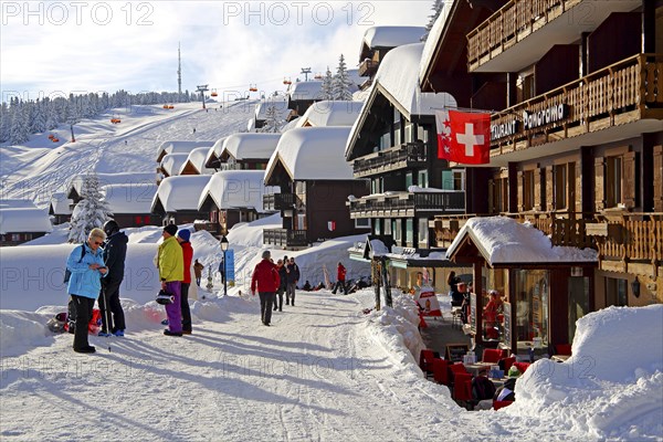 Village road with snow-covered houses