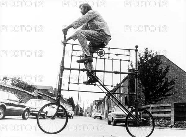 Man on curious big bike