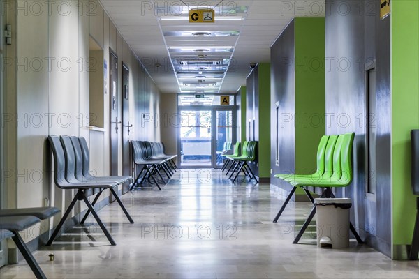 Corridor with chairs for patients in a modern hospital