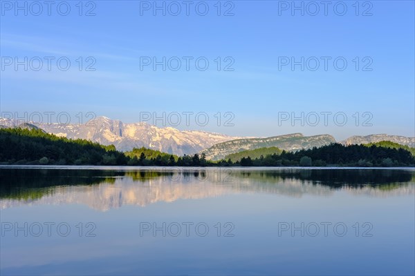 Nemercka Mountains is reflected in the lake