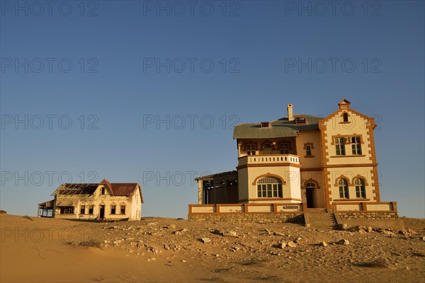 Decaying houses of the accountant and mine manager of the former diamond town Kolmanskop