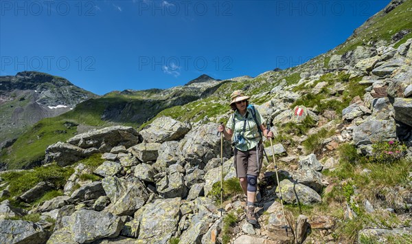 Hiker on the descent from Vetternscharte to Keinprechthutte