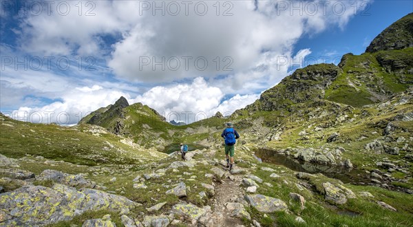 Hikers at small lakes in the Klafferkessel