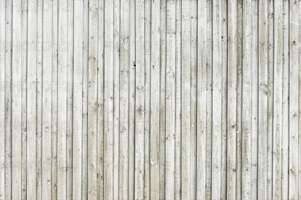 Wooden wall made of horizontally arranged unpainted boards