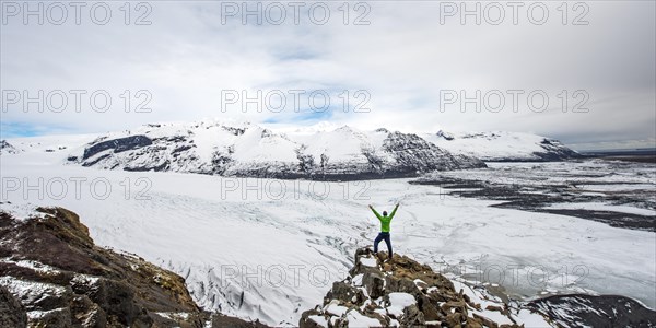 Hiker stretches his arms up