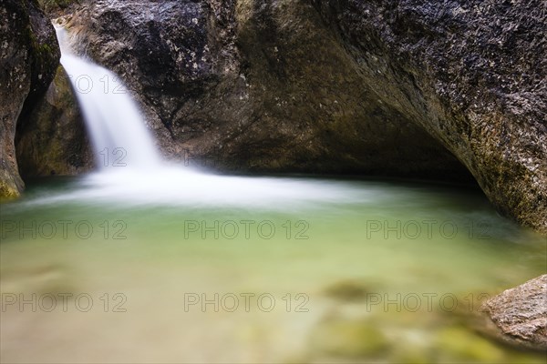 Almbach gorge with waterfall