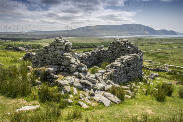 Dilapidated stone walls of a former village