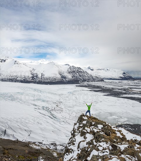 Hiker stretches his arms up