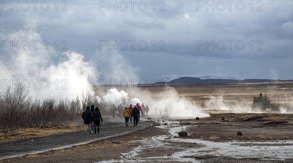 Tourists at the Haukadalur geothermal field