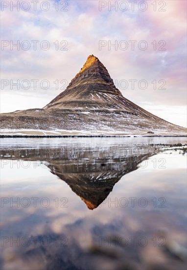 Mount Kirkjufell reflected in the water