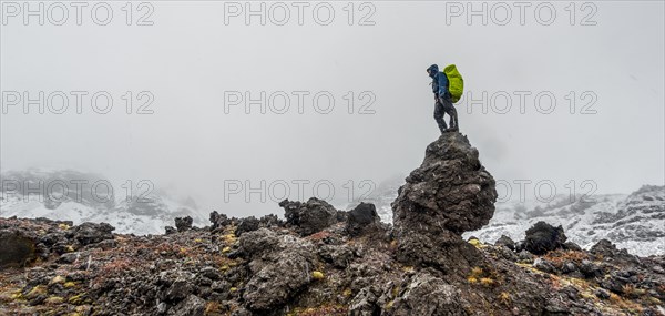 Hiker standing on rock