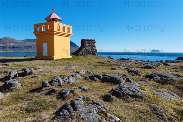 Orange lighthousehouse