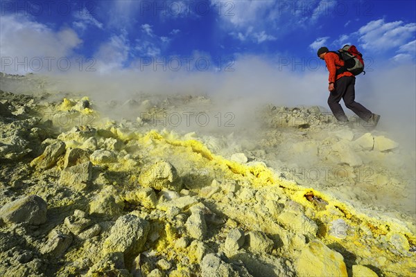 Hiker on the Gran Cratere walks through sulphur fumaroles