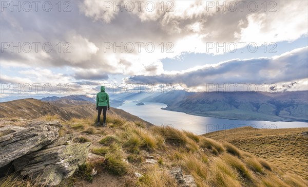 Female hiker woman looking at lake