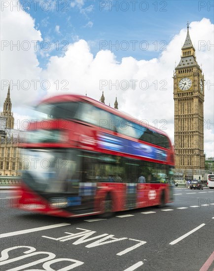 Red double-decker bus on the Westminster Bridge