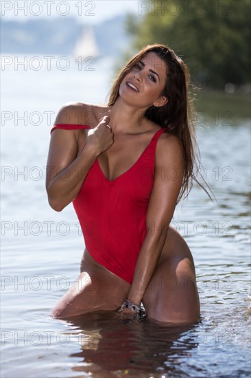 Young woman in red bathing suit