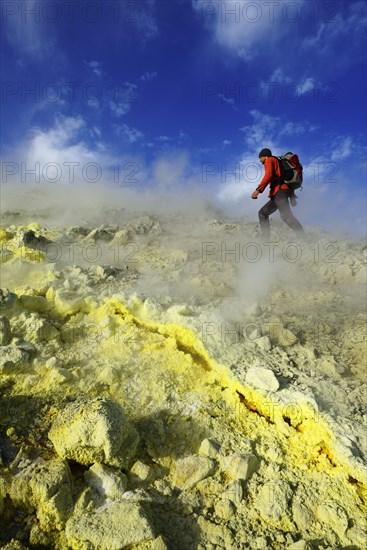 Hiker on the Gran Cratere walks through sulphur fumaroles