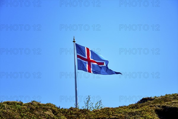 Icelandic flag against blue sky