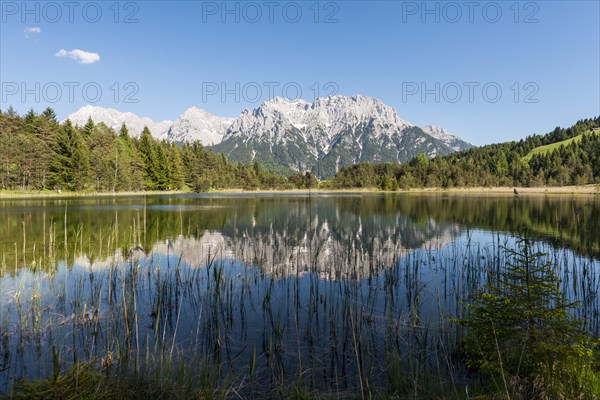 Western Karwendelspitze is reflected in the Luttensee