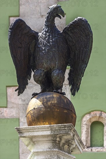 Eagle on golden ball