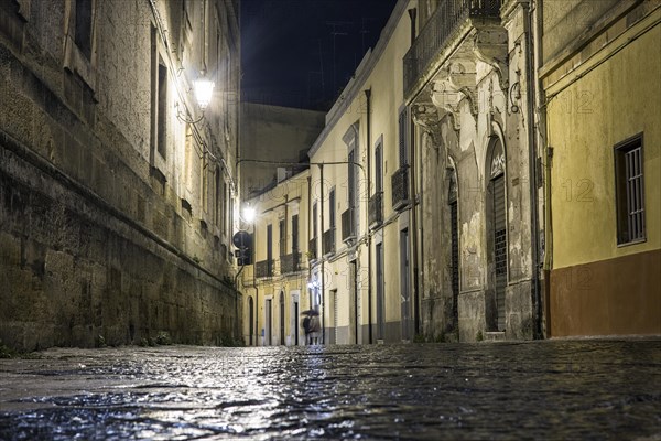 Street at night with disappearing couple