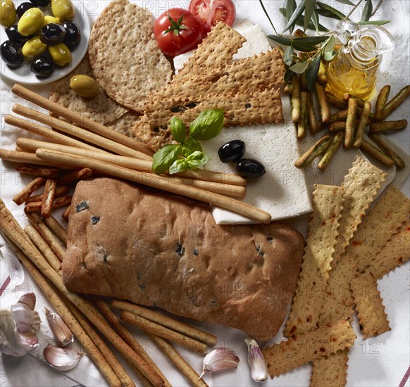 Various Italian baked goods with decoration of olive branches