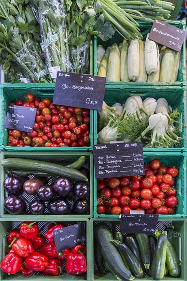 Fresh organic vegetables in crates at a weekly market