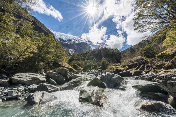 Glacial river flowing through mountains