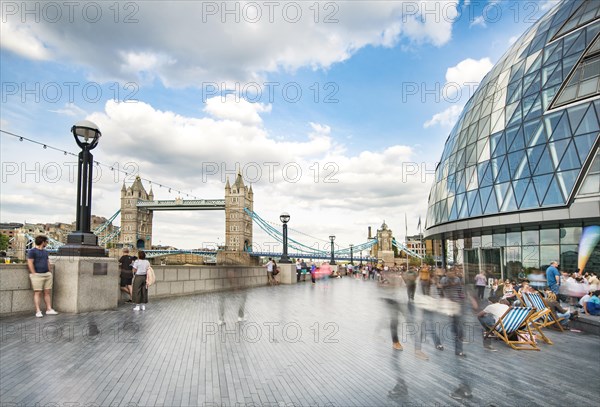 Passers-by on the promenade More London Riverside