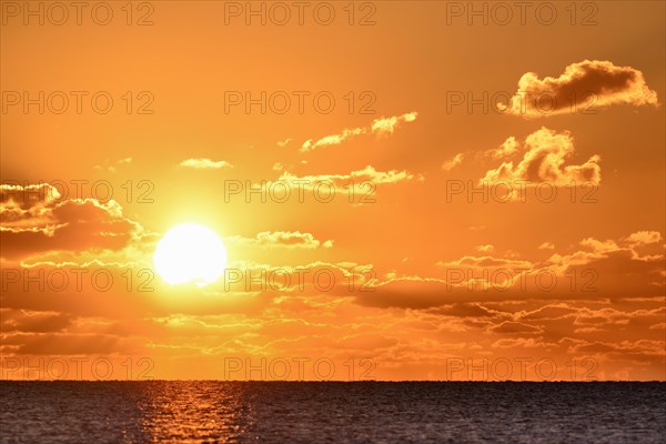 Sunset with cloudy sky above the North Sea