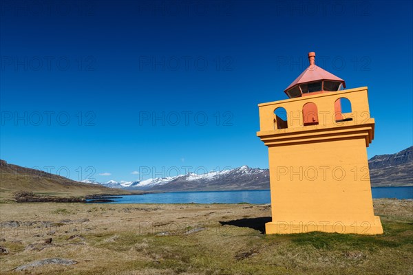 Orange lighthousehouse