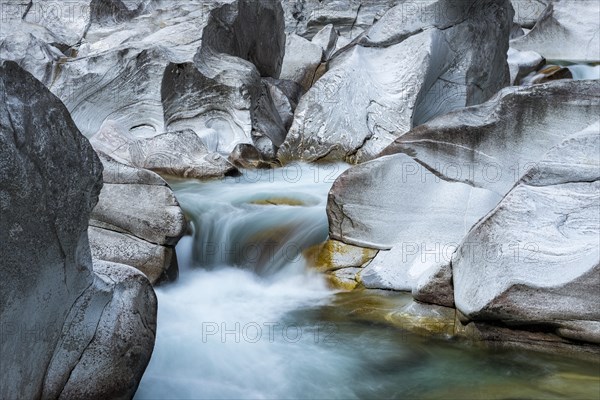 The Verzasca River flows through rocky landscape