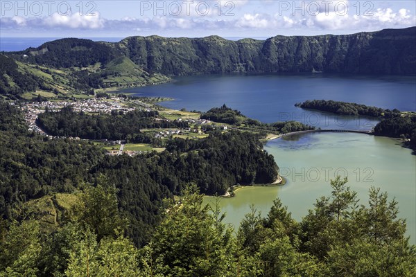 View from Miradouro da Vista do Rei into the volcanic crater Caldera Sete Cidades with the crater lakes Lagoa Verde and Lago Azul