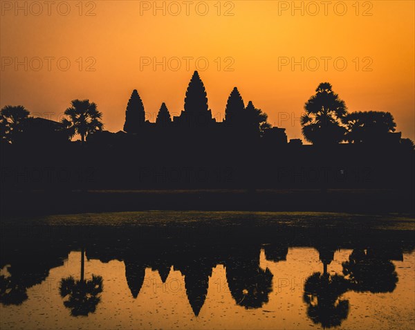 Temple complex of Angkor Wat reflected in the water basin