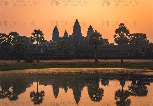 Temple complex of Angkor Wat reflected in the water basin